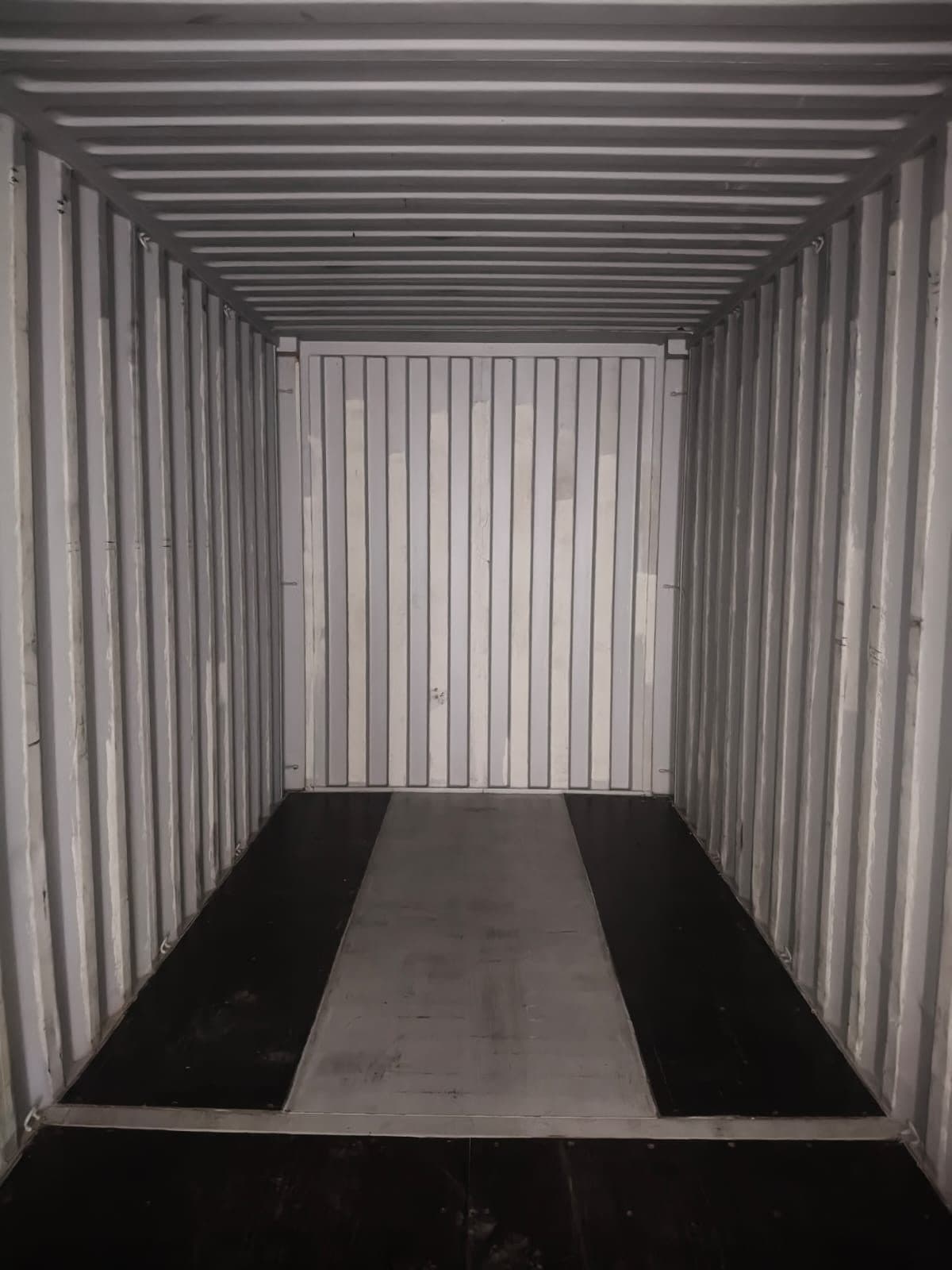 Interior of an empty shipping container during a condition inspection